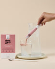 Noa & Co Breastfeeding Support 10 sachets box, with sachet being poured into water