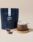 Noa & Co Deep Sleep Hot Chocolate pouch, with a mug of hot chocolate