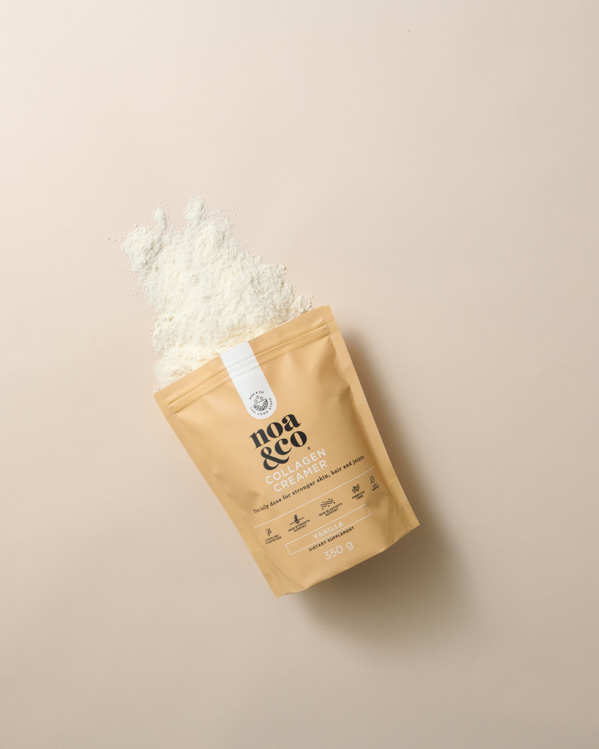 Noa & Co Vanilla Collagen Creamer pouch, with powder pouring out