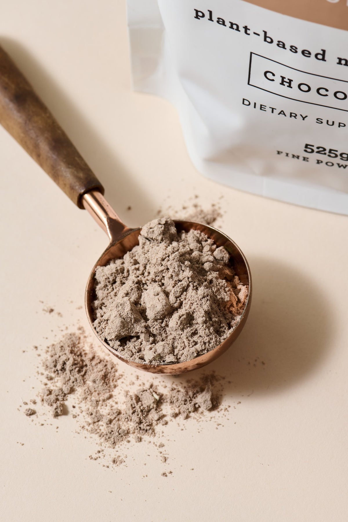 Scoop of Chocolate Replenishing Protein powder