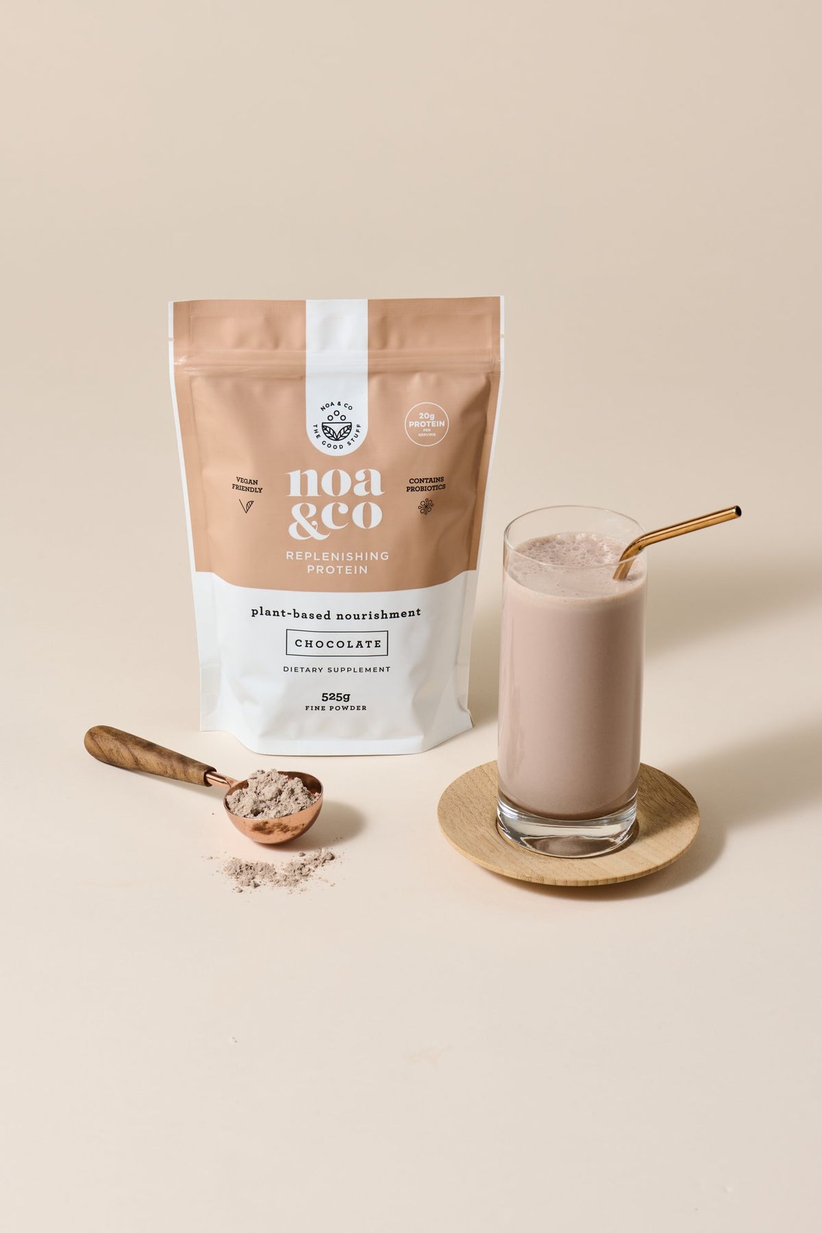 Chocolate Replenishing Protein with a scoop and a chocolate shake