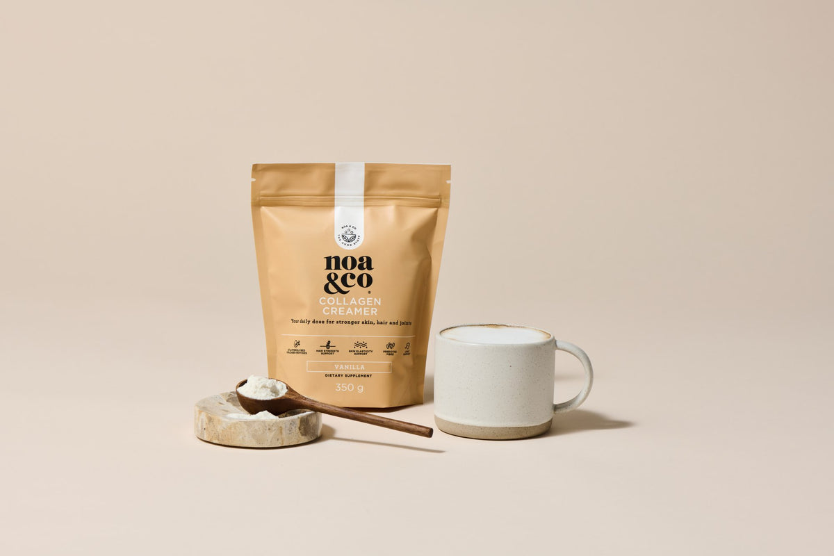 Collagen Creamer pouch with a scoop of powder and a mug