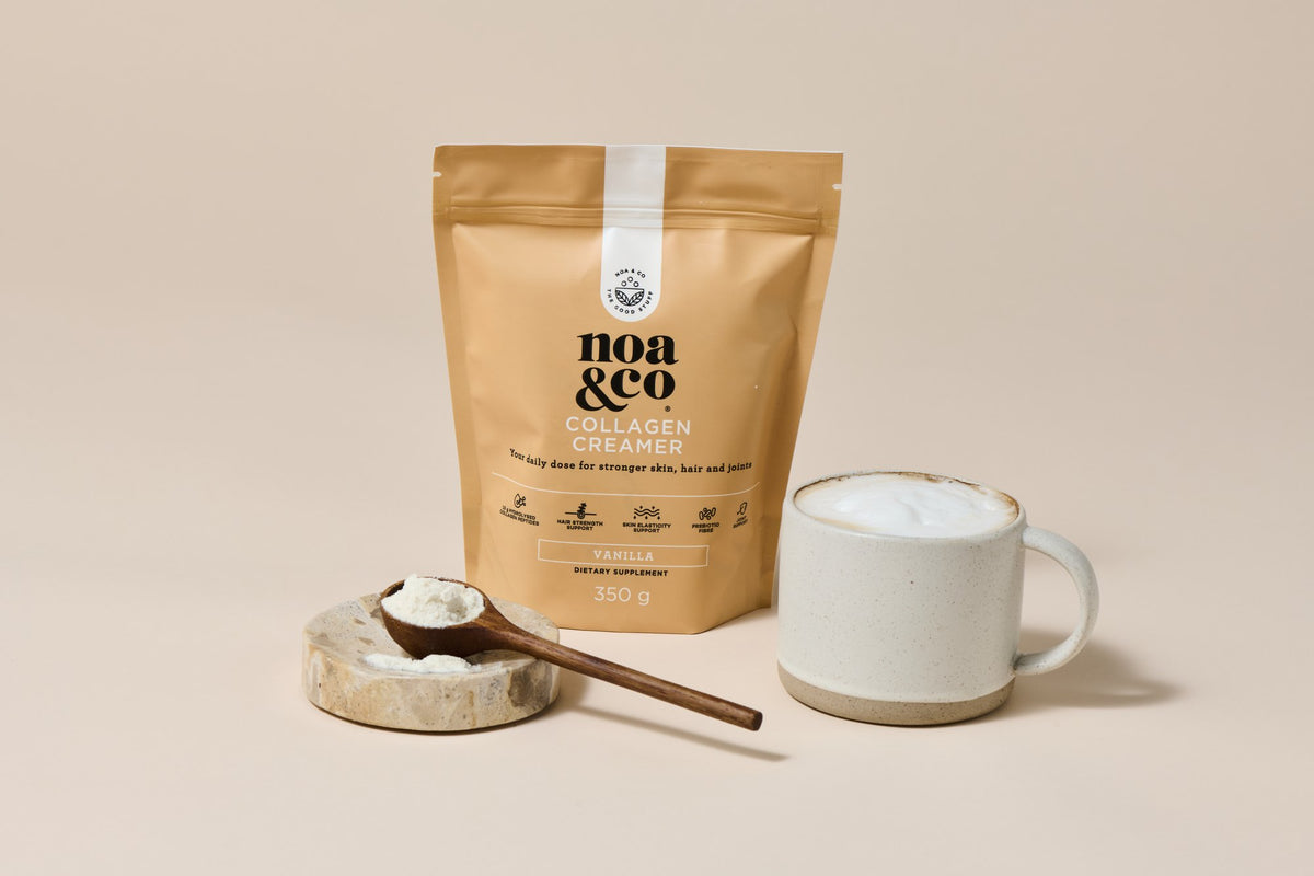 Collagen Creamer pouch with a scoop of powder and a mug