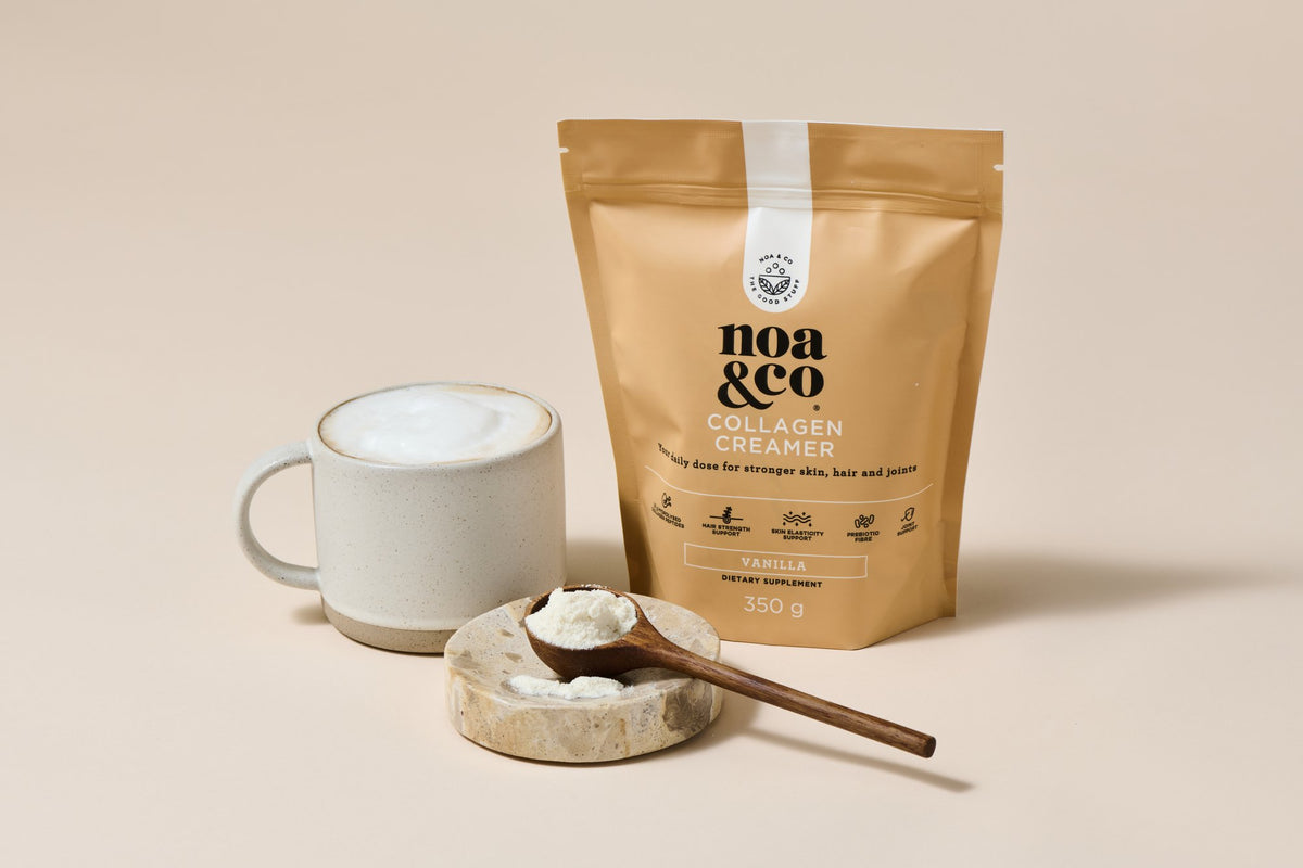 Collagen Creamer pouch with a scoop of powder and a mug