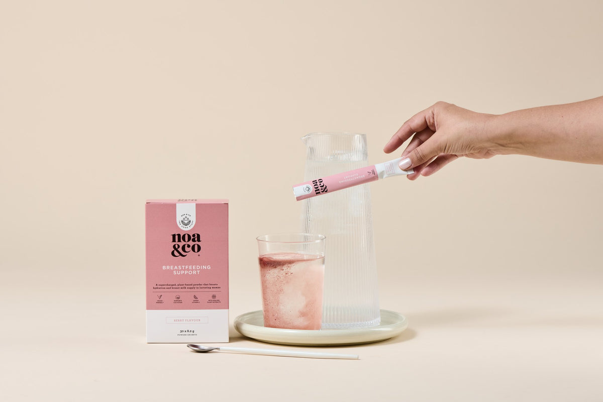 Breast Feeding Support sachet being poured into a glass of water