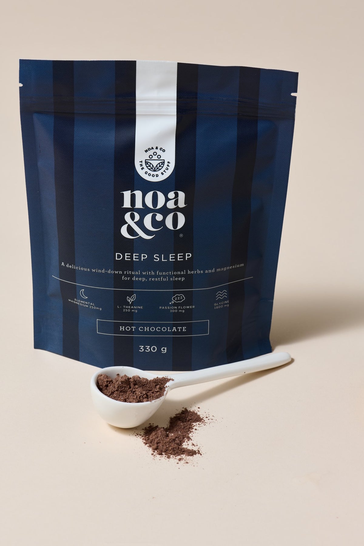 Deep Sleep Hot Chocolate pouch with a scoop of powder