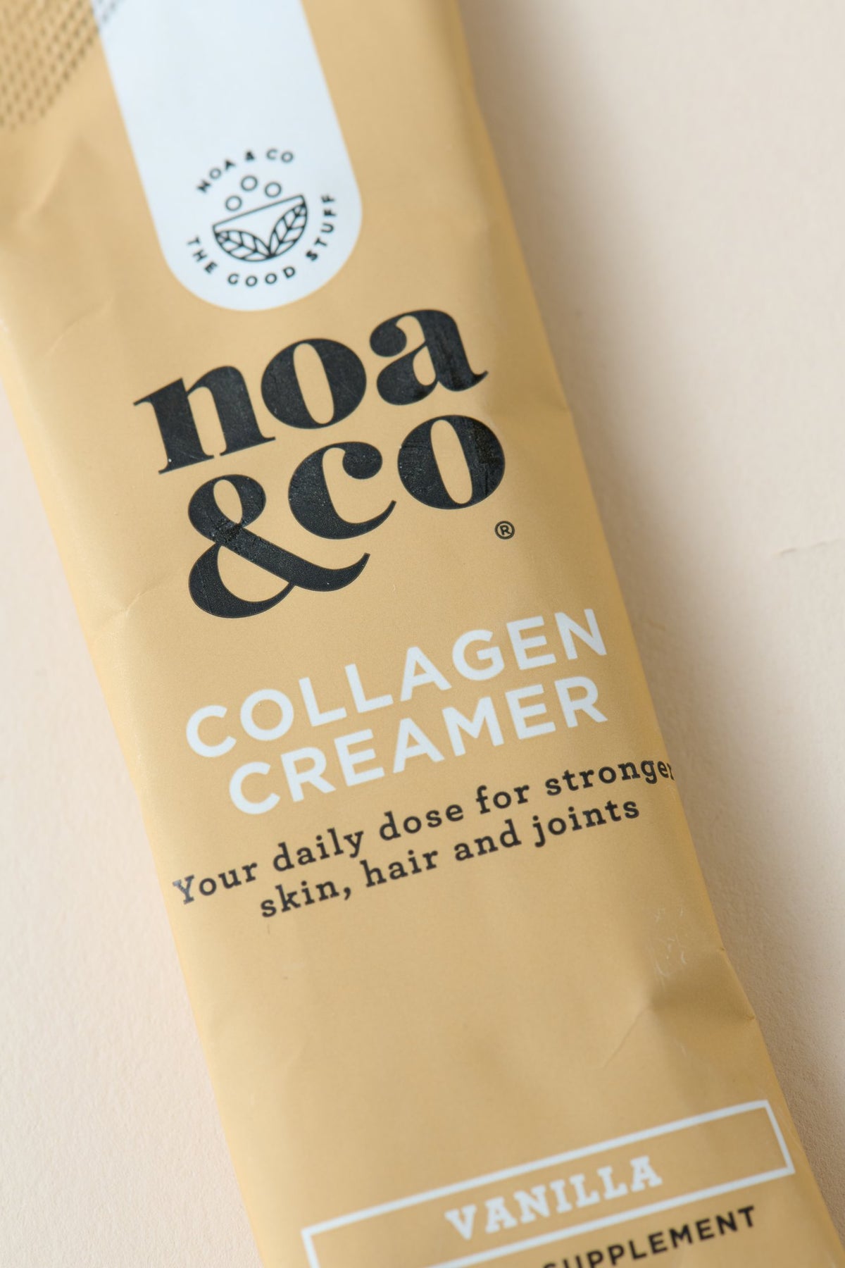Close-up of a Collagen Creamer sachet