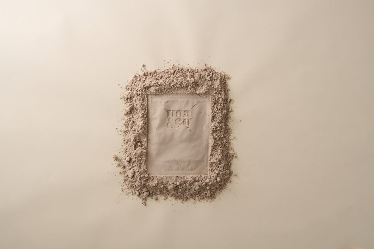 Noa & Co logo pressed into chocolate protein powder