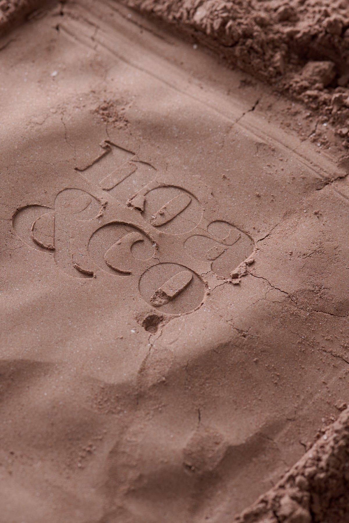 Noa & Co logo pressed into hot chocolate powder